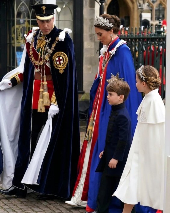 Princess Charlotte with a flower wreath as Princess Catherine holding hands with brother Louis at the coronation