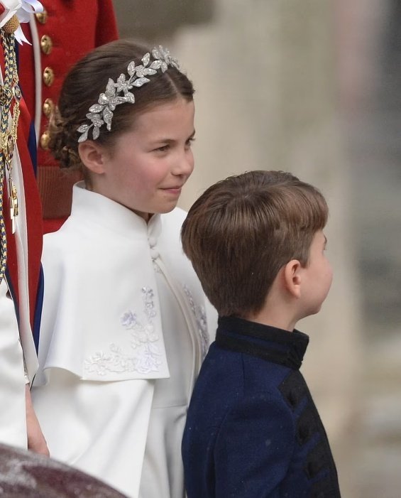 Princess Charlotte with a flower wreath as Princess Catherine holding hands with brother Louis at the coronation