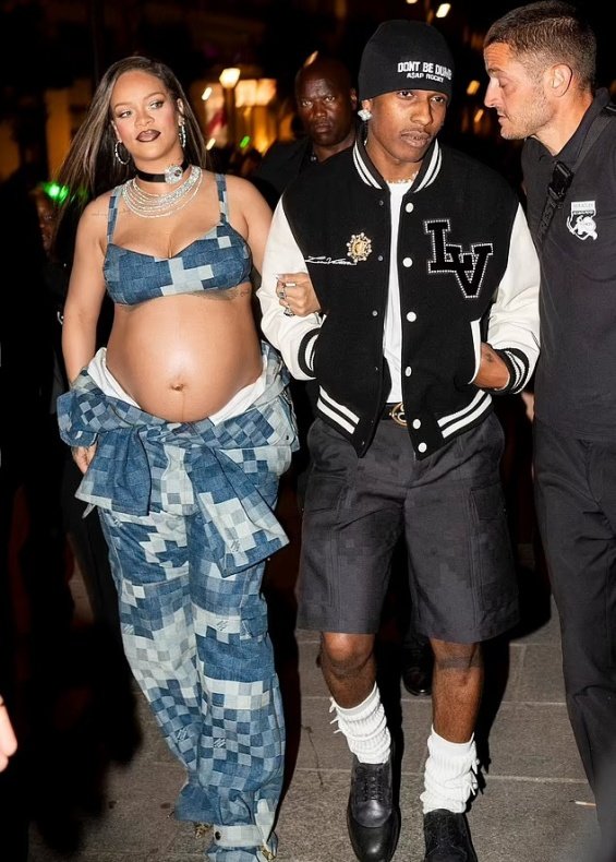 Rihanna bares her pregnant belly in denim styling at the Louis Vuitton men's show