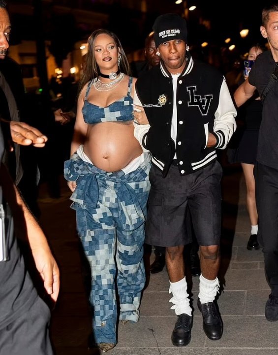 Rihanna bares her pregnant belly in denim styling at the Louis Vuitton men's show