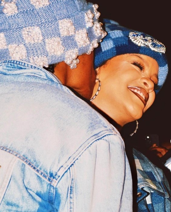 Rihanna bares her pregnant belly in denim styling at the Louis Vuitton men's show