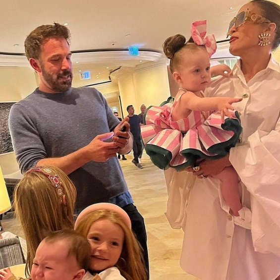 Jennifer Lopez In A White Shirt-dress With Ben Affleck Posed With Small Fans