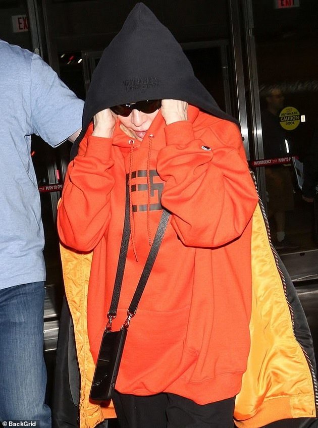 Madonna Caught At Airport In Oversized Outfit And Glasses Hiding Wrinkled Arms And Face