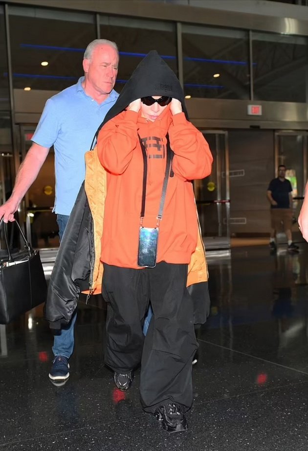 Madonna Caught At Airport In Oversized Outfit And Glasses Hiding Wrinkled Arms And Face
