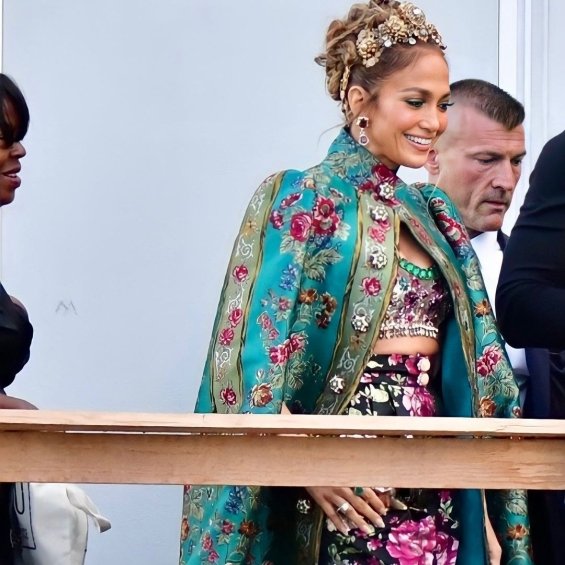 Jennifer Lopez in a floral outfit with a gown at the fashion show of ...